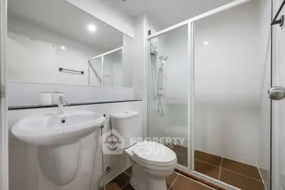Modern bathroom with glass shower and sleek fixtures