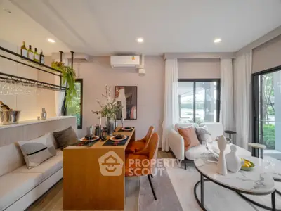 Modern open-plan living and dining area with stylish decor and natural light
