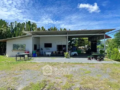 Charming rural property with open-air design and lush greenery, perfect for relaxation and outdoor activities.