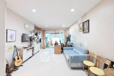 Spacious living room with modern decor and natural light