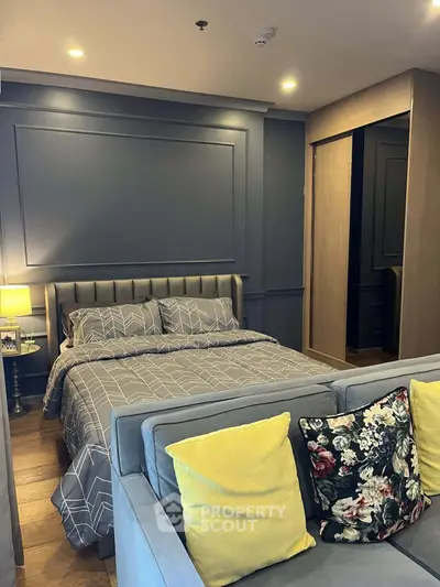 Modern bedroom with stylish decor and cozy ambiance, featuring a comfortable bed and elegant furnishings.