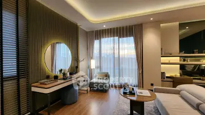 Luxurious modern living room with elegant decor and large windows offering natural light.
