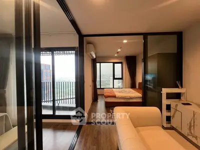 Modern apartment with glass partitions and balcony view