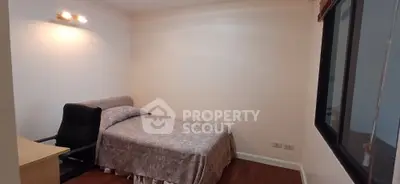 Cozy bedroom with modern furnishings and elegant lighting, perfect for a comfortable living experience.