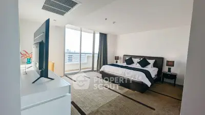 Spacious modern bedroom with large windows and stylish decor