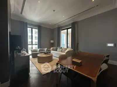 Spacious modern living room with elegant decor and large windows