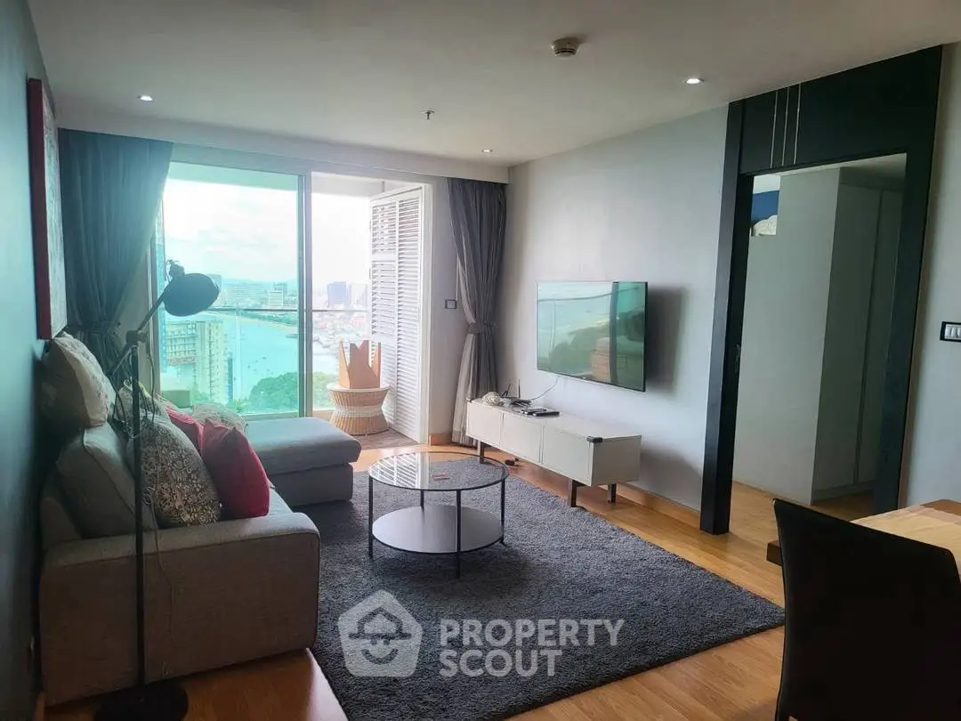 Modern living room with stunning city view and cozy furnishings