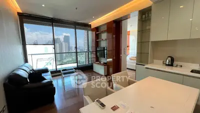Modern open-plan living room with city view and sleek kitchen design.