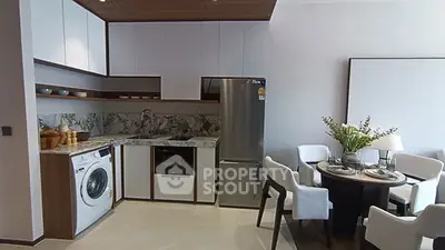 Modern kitchen with sleek design and elegant dining area