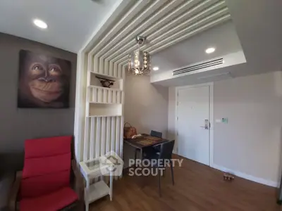 Modern living room with unique ceiling design and cozy dining area