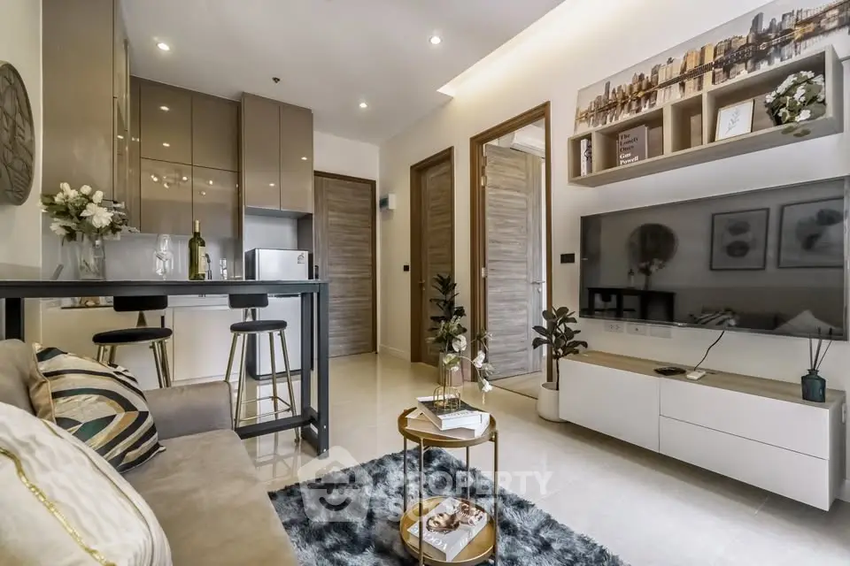 Modern living room with stylish decor and open kitchen layout in a contemporary apartment.