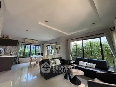 Spacious modern living room with large windows and stylish furniture