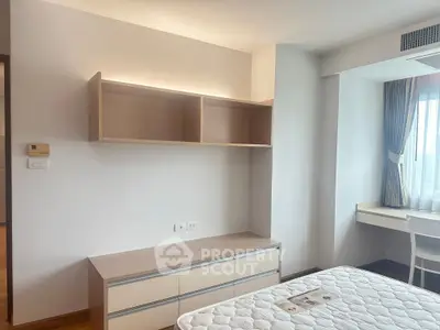 Bright and airy bedroom with modern furniture and large window view