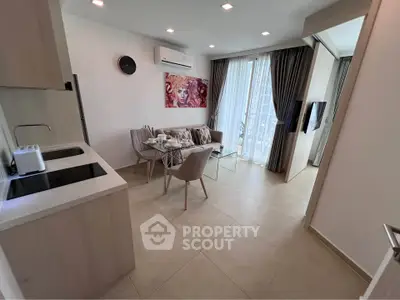 Modern open-plan living room with stylish kitchen and dining area