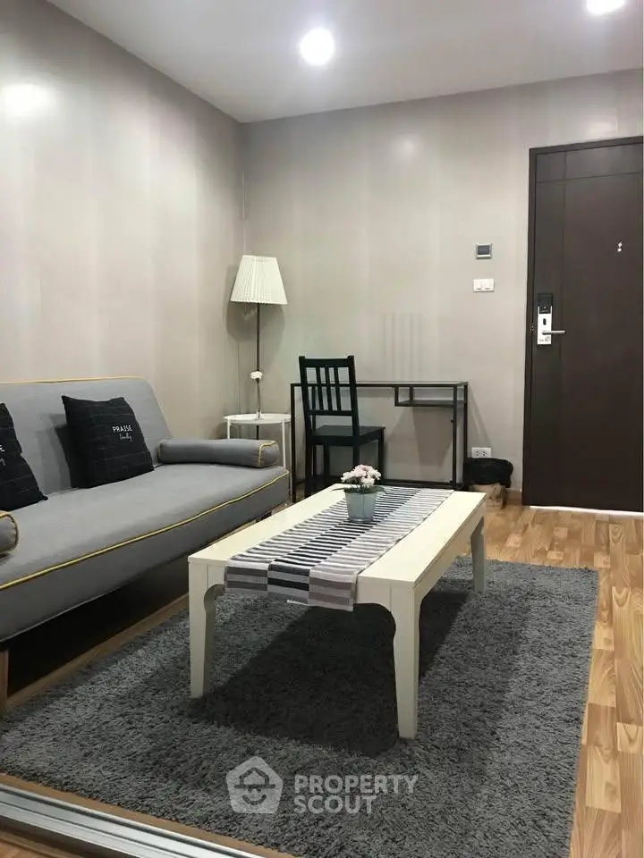 Modern living room with stylish furniture and cozy decor in a contemporary apartment.