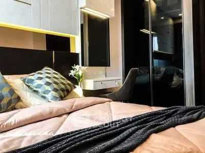Luxurious modern bedroom with stylish decor and cozy ambiance.