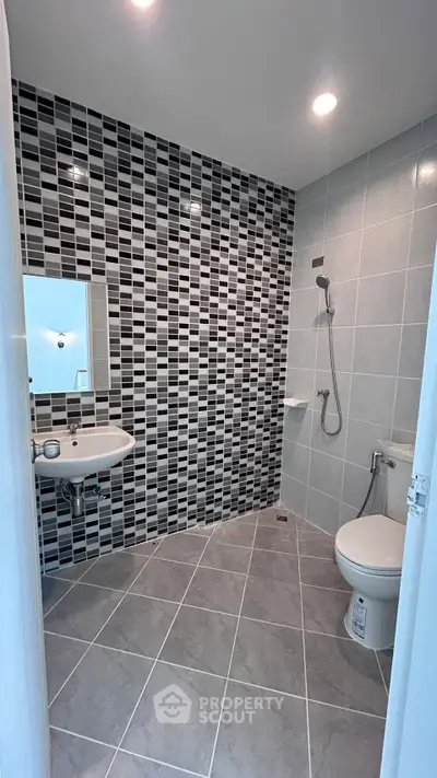 Modern bathroom with stylish tile design and sleek fixtures