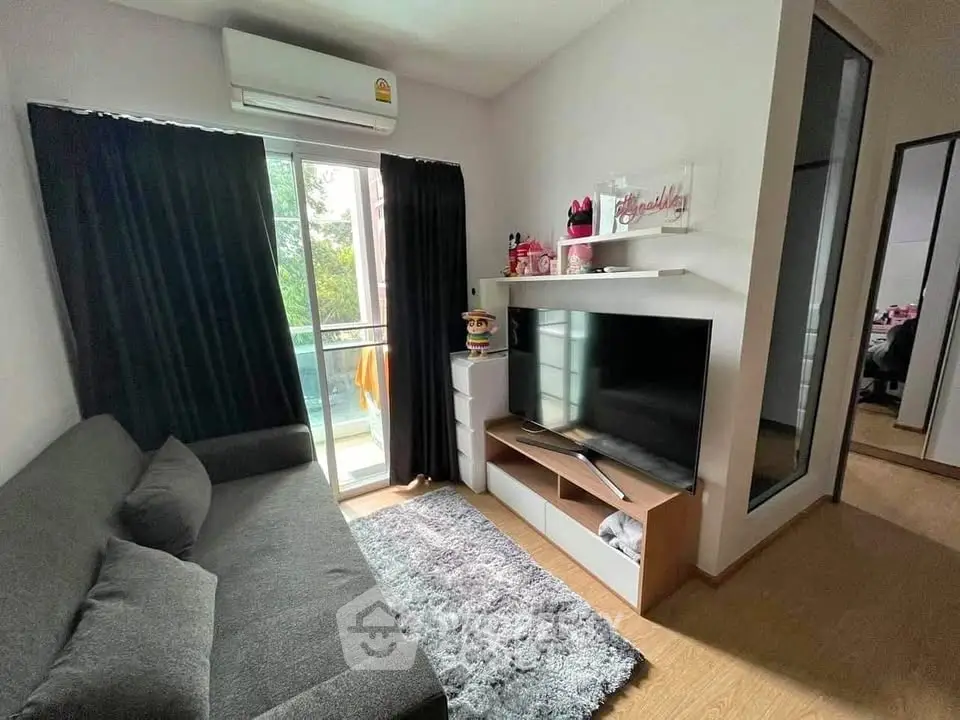 Cozy living room with modern decor and balcony access