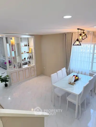 Elegant dining area with modern decor and natural light