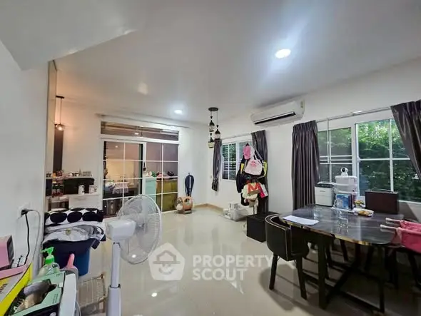 Spacious living room with dining area and modern decor