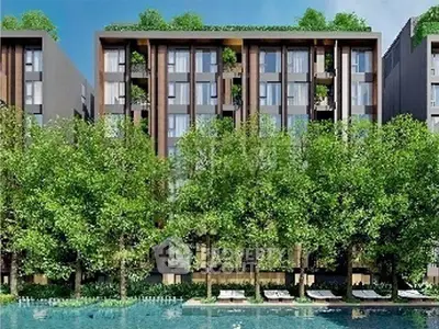Luxurious modern apartment building with lush greenery and pool view