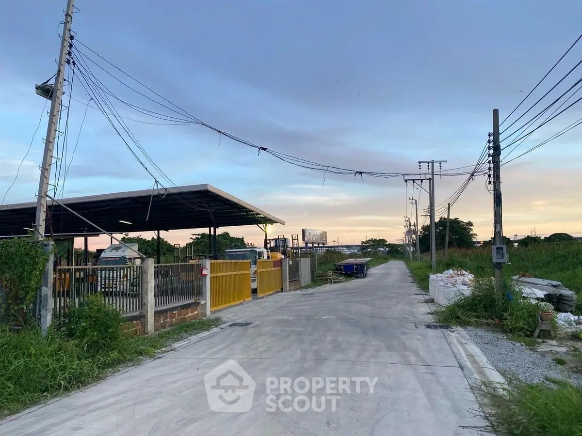 Spacious industrial lot with ample outdoor space and utility access, perfect for development opportunities.