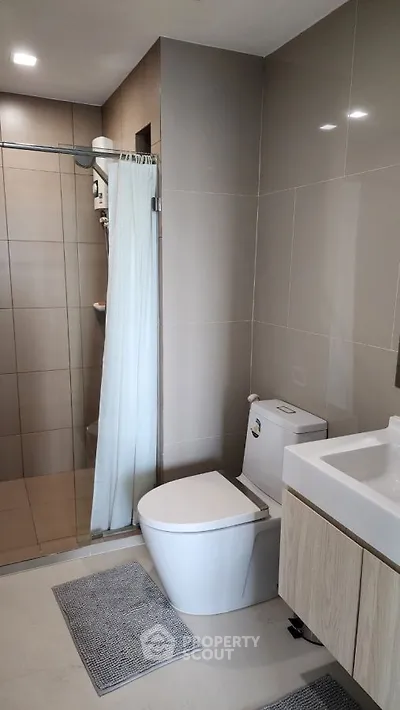 Modern bathroom with sleek design and glass shower enclosure