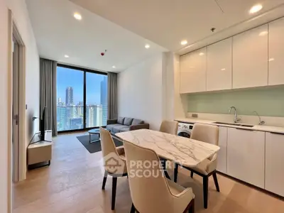Modern open-plan living room with city view, sleek kitchen, and elegant dining area.