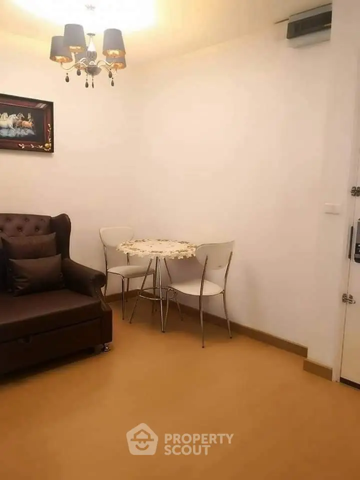 Cozy living room with elegant decor and compact dining area, perfect for modern urban living.