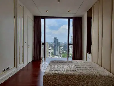 Luxurious bedroom with stunning city view and elegant decor
