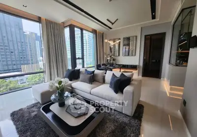 Luxurious modern living room with stunning city view, elegant decor, and spacious seating area in high-rise apartment.