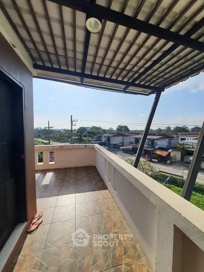 Spacious balcony with scenic view and modern roofing