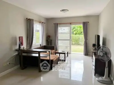 Spacious living room with modern furniture and garden view