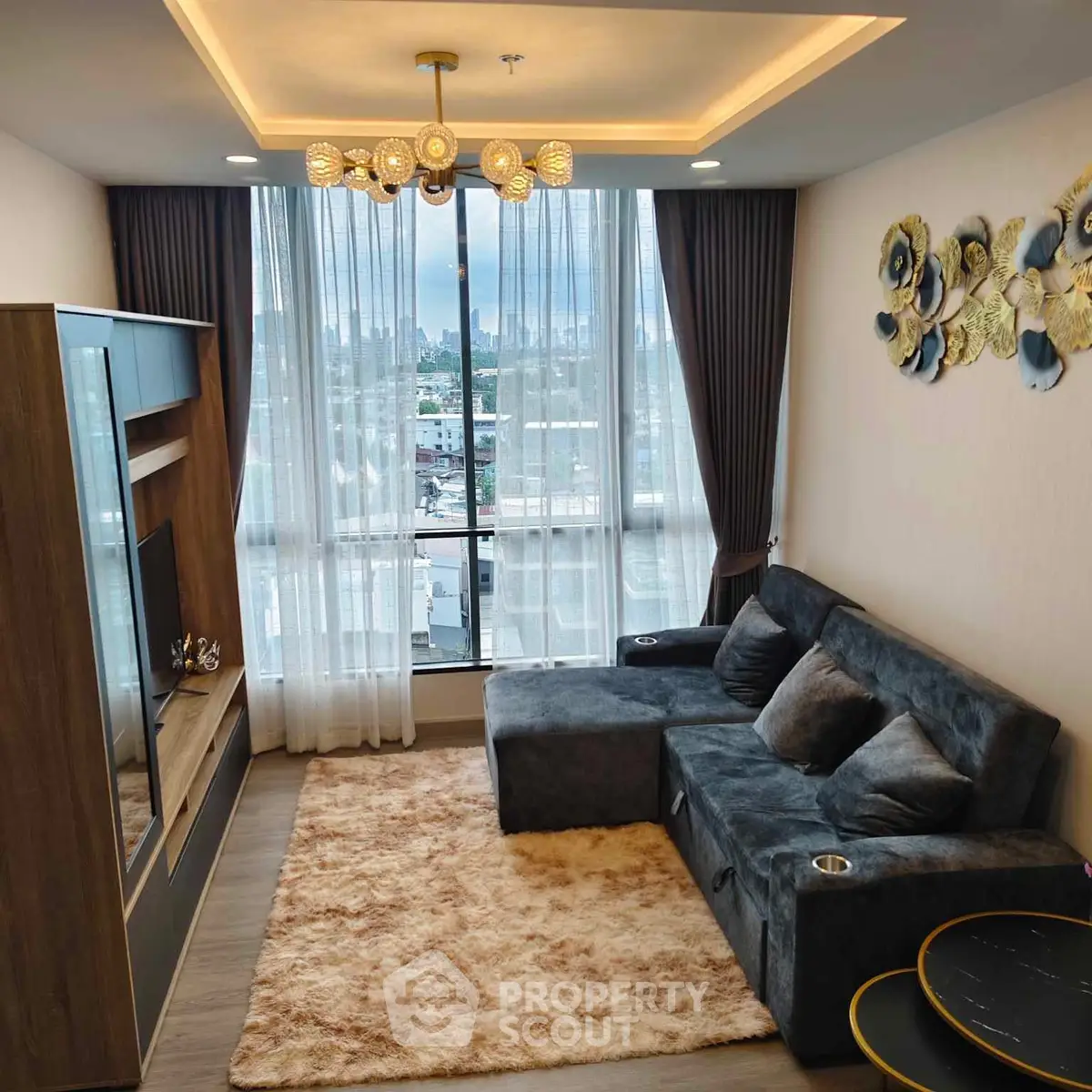 Modern living room with plush sofa and city view, perfect for relaxation and entertainment.