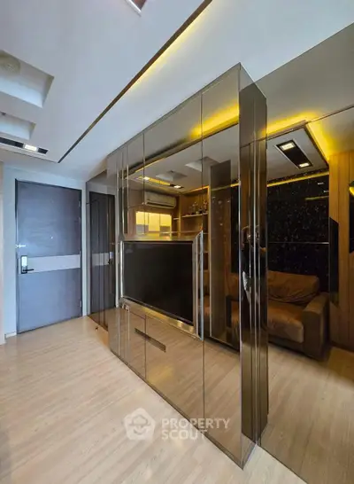 Luxurious modern living room with mirrored walls and sleek design