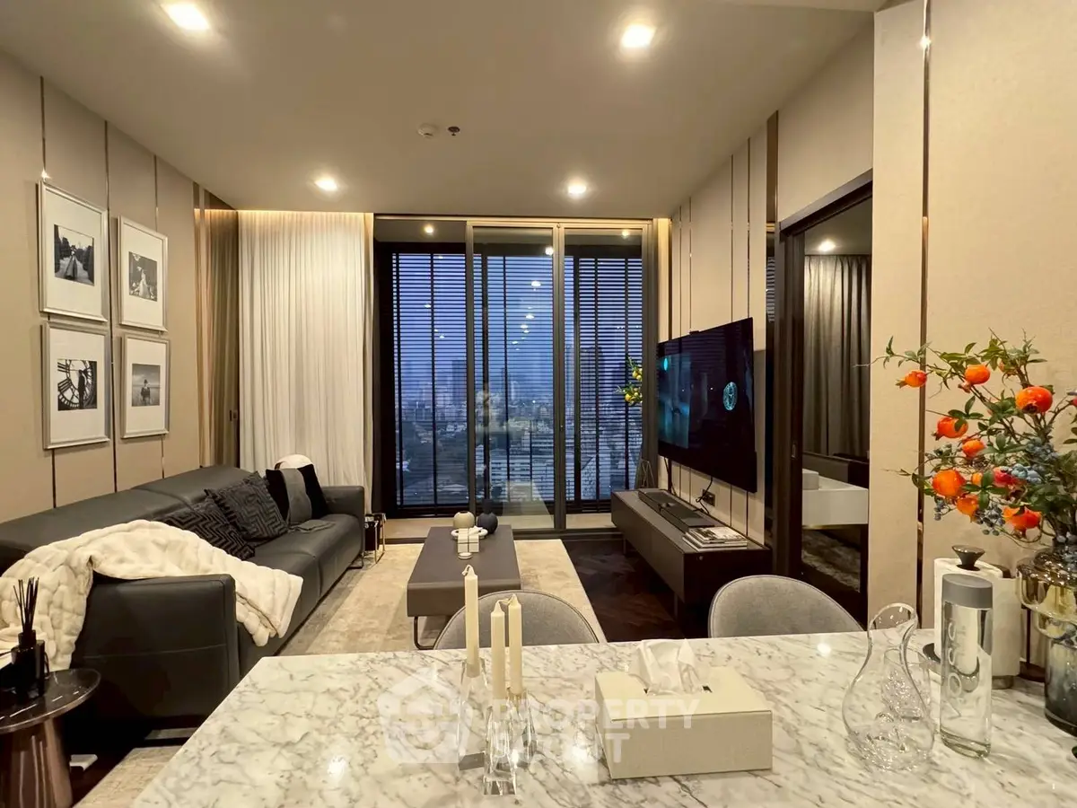 Luxurious modern living room with city view, elegant decor, and cozy ambiance