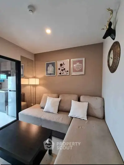 Modern living room with stylish decor and cozy seating area in a contemporary apartment.