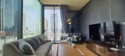 Luxurious modern living room with stunning city view and elegant decor.