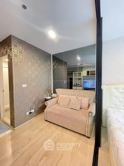 Stylish modern living room with elegant wallpaper and cozy sofa in a chic apartment
