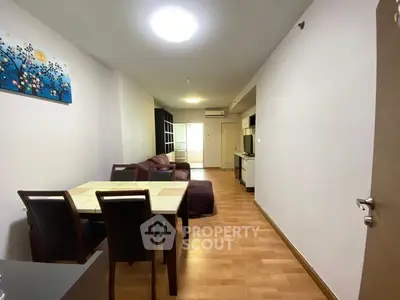 Spacious living room with modern dining area and cozy seating