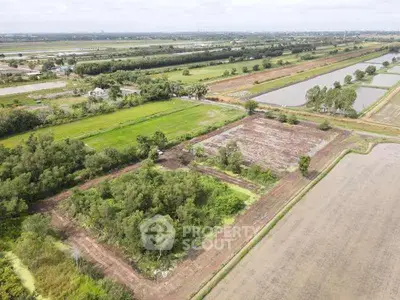 Expansive aerial view of lush farmland with potential for development.