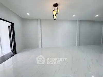 Spacious modern living room with elegant lighting and marble flooring