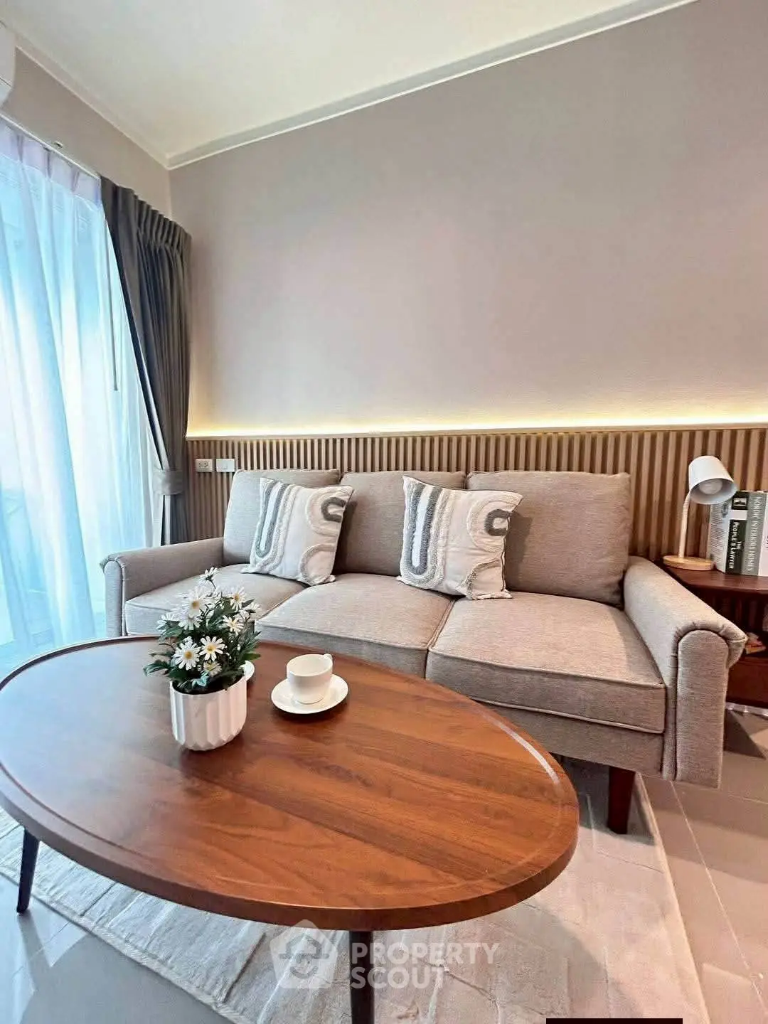 Chic living room with modern sofa and elegant coffee table, perfect for cozy gatherings.