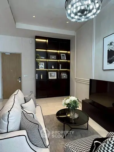 Elegant living room with modern decor, plush seating, and stylish shelving unit.