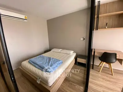 Modern bedroom with minimalist design and wooden flooring