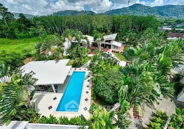 Luxurious tropical villa with stunning pool and lush greenery