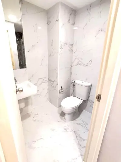 Modern bathroom with marble tiles and sleek fixtures