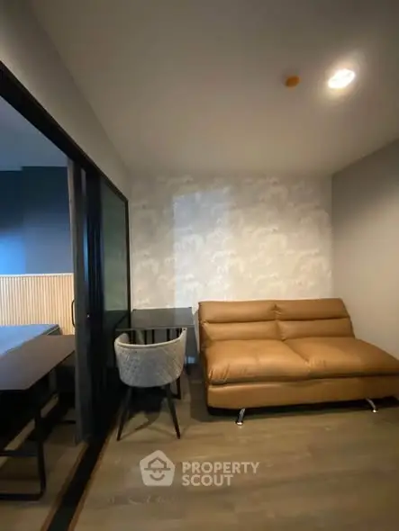 Modern living room with stylish sofa and sleek glass partition
