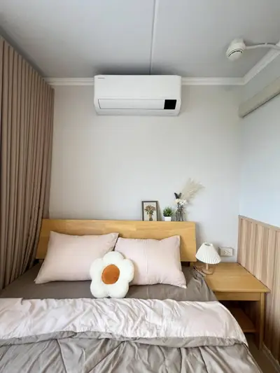 Cozy bedroom with modern air conditioning and stylish decor