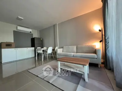 Modern living room with sleek furniture and natural light, perfect for relaxation and entertaining.